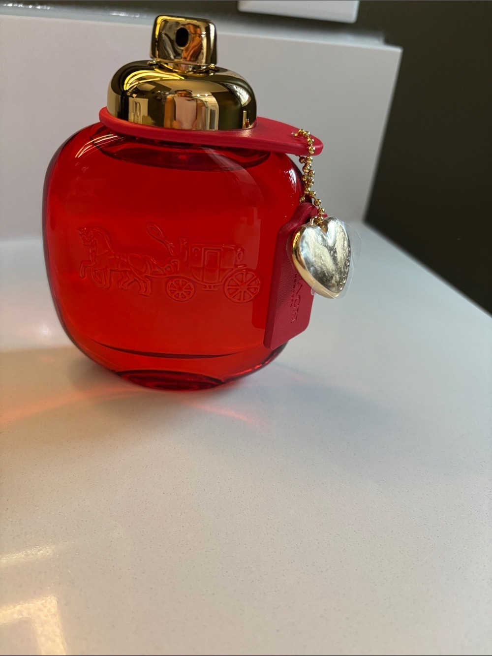 Coach Red Glass Bottle with Gold Cap and Heart Charm